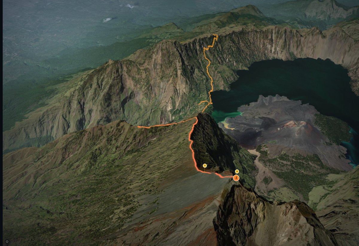 Still from the Maptale film of the Rinjani climb: the route as a line over the crater rim, the crater lake beside it, photo points along the line