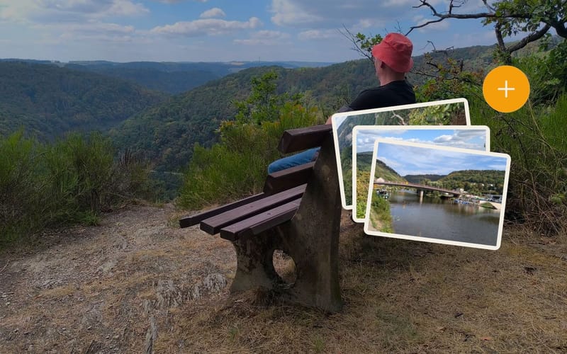 A rest with a view over the Lahn valley, with a small stack of photos and a plus sign