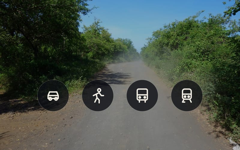 A dusty track with four icons for car, running, bus and train